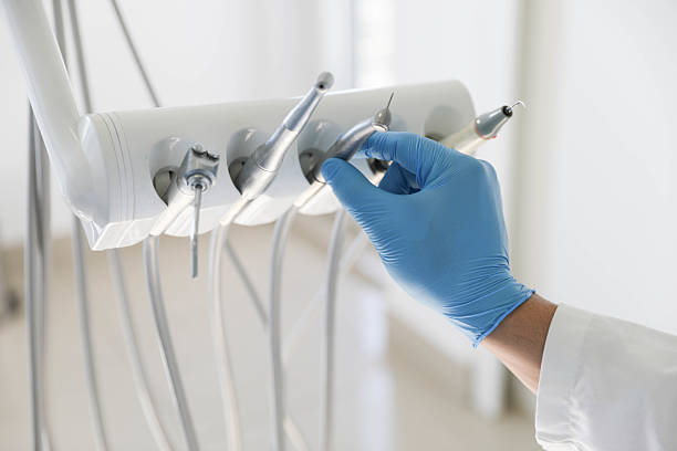 Professional Tooth Extraction technician working in Robertsville, NJ